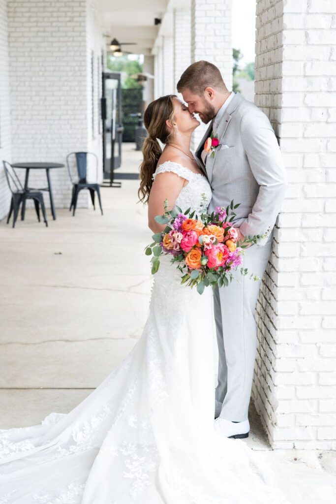 A bride and groom posing for wedding day photos at BASH