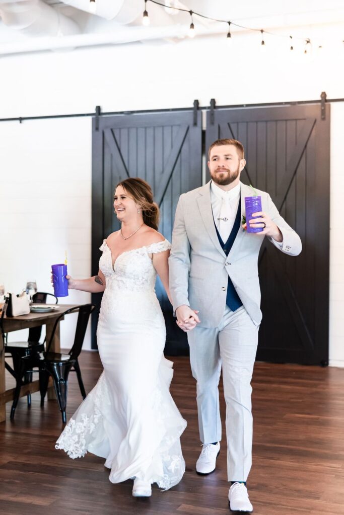 A bride and groom entering their wedding reception at BASH