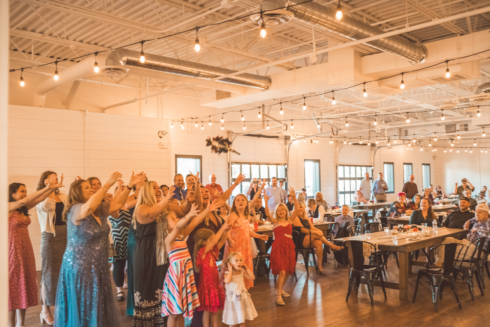 Wedding guests ready to catch the bouquet at a wedding at BASH in Carmel, Indiana