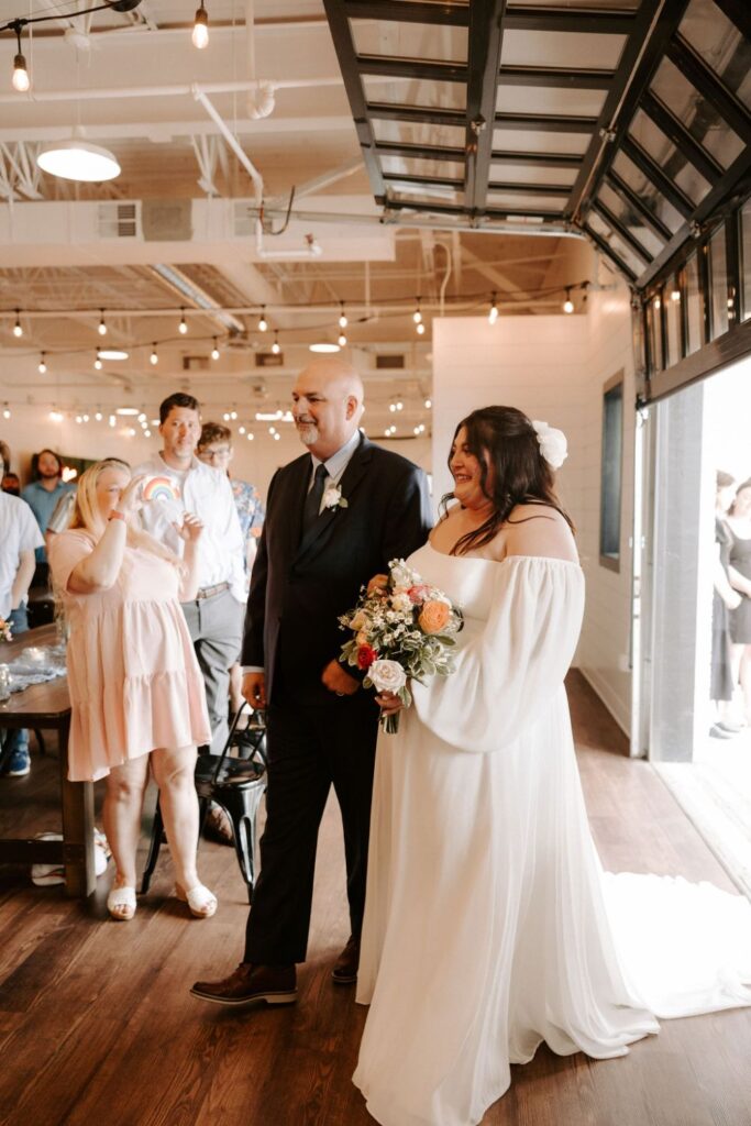 Bride walking down the aisle with dad