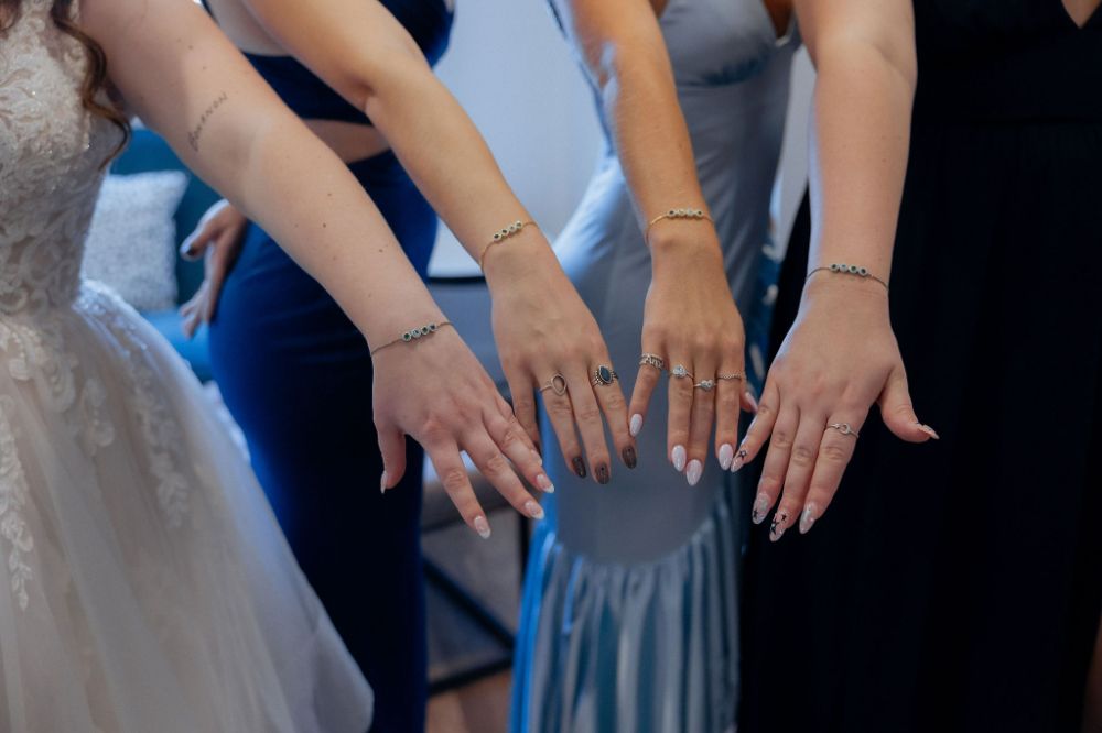 Bridal party showing off matching bracelets