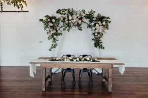 Sweetheart table with greenery and florals at BASH in Carmel, IN