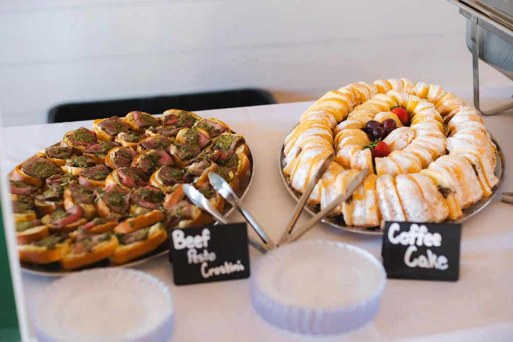 Catering appetizers beautifully arranged on a table at BASH Carmel wedding & event venue
