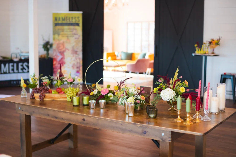 Guests creating personalized tablescapes at the design station in BASH Carmel wedding & event venue