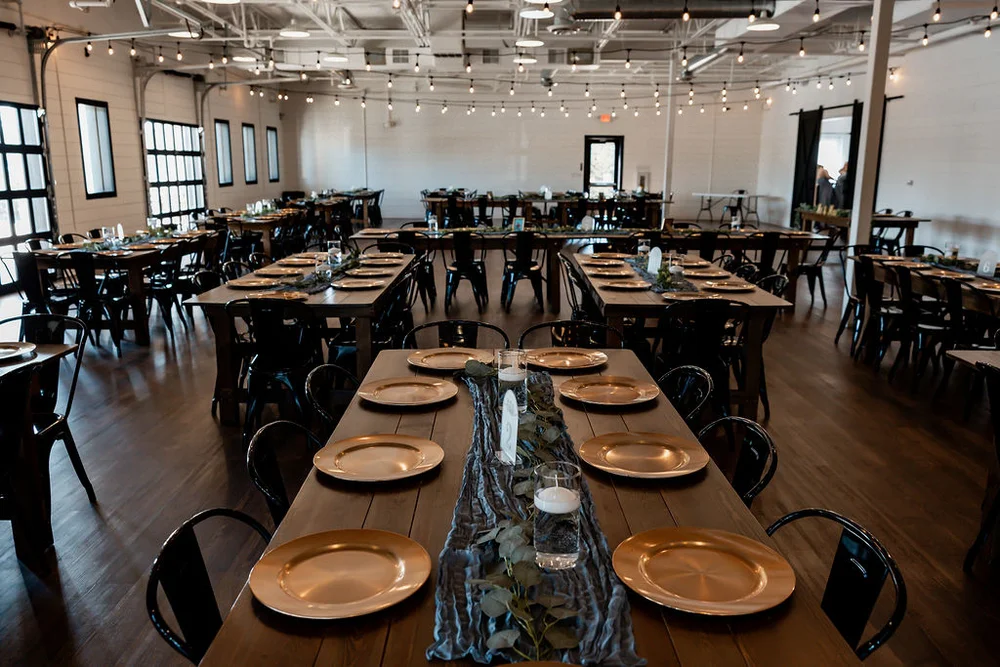 Wedding reception setup at BASH venue featuring elegantly arranged tables and chairs ready for guests.