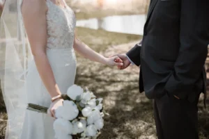 Bride and groom holding hands
