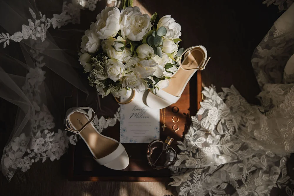 Wedding day details including rings, invitations, and florals at Carmel, Indiana wedding