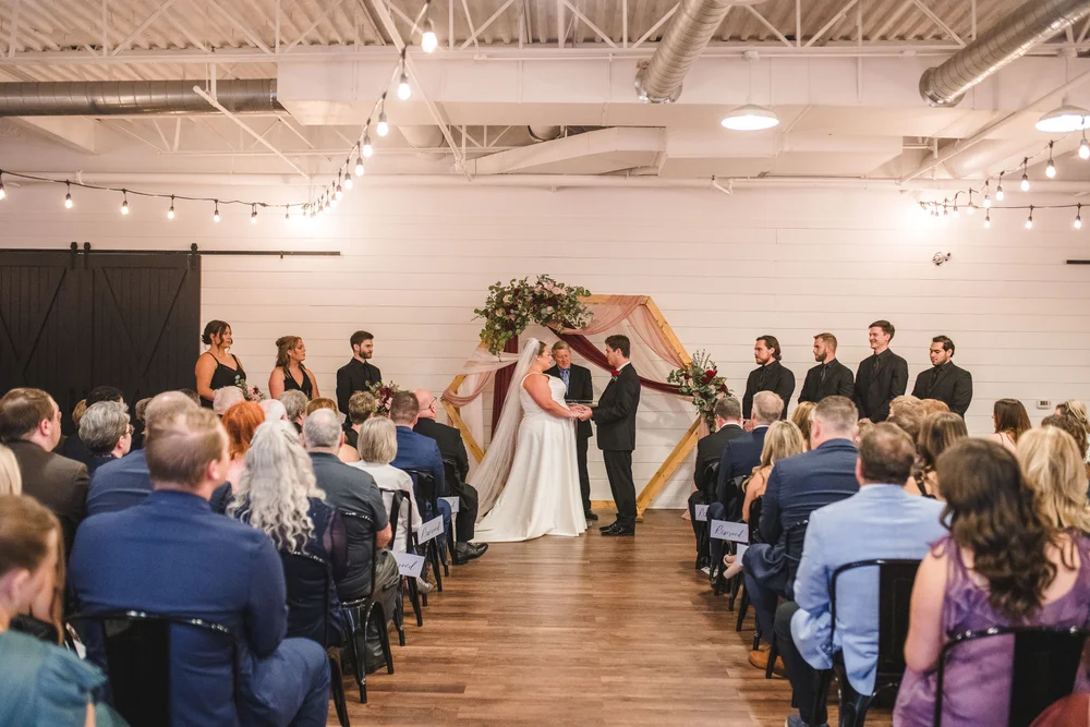 Couple saying their vows at BASH in Carmel, IN