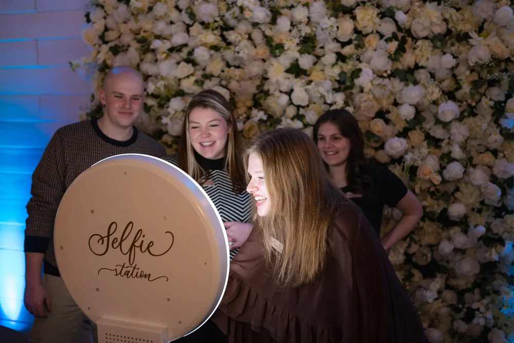 Guests taking photos at selfie station during BASH Spring Open House 2026 in Carmel Indiana