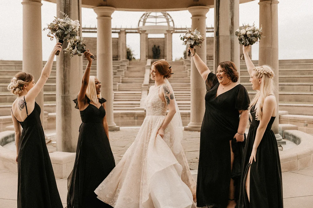 Bride and bridesmaids at an outdoor summer wedding ceremony in Carmel Indiana