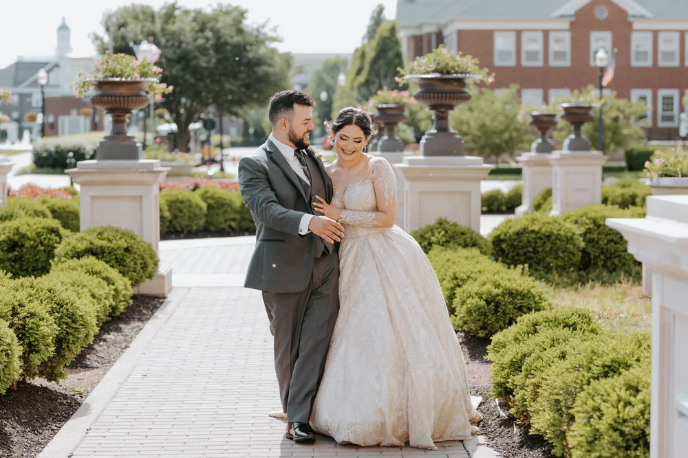 Bride and groom walking outside in Carmel, IN